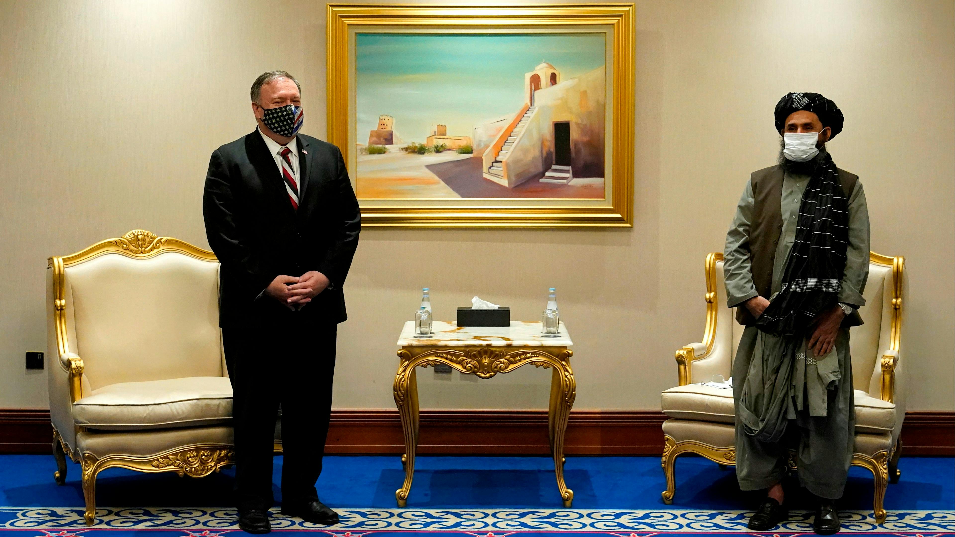 US Secretary of State Mike Pompeo (L) meets with Taliban co-founder Mullah Abdul Ghani Baradar in the Qatari capital Doha on November 21, 2020, amid signs of progress in their talks as Washington speeds up its withdrawal. 
