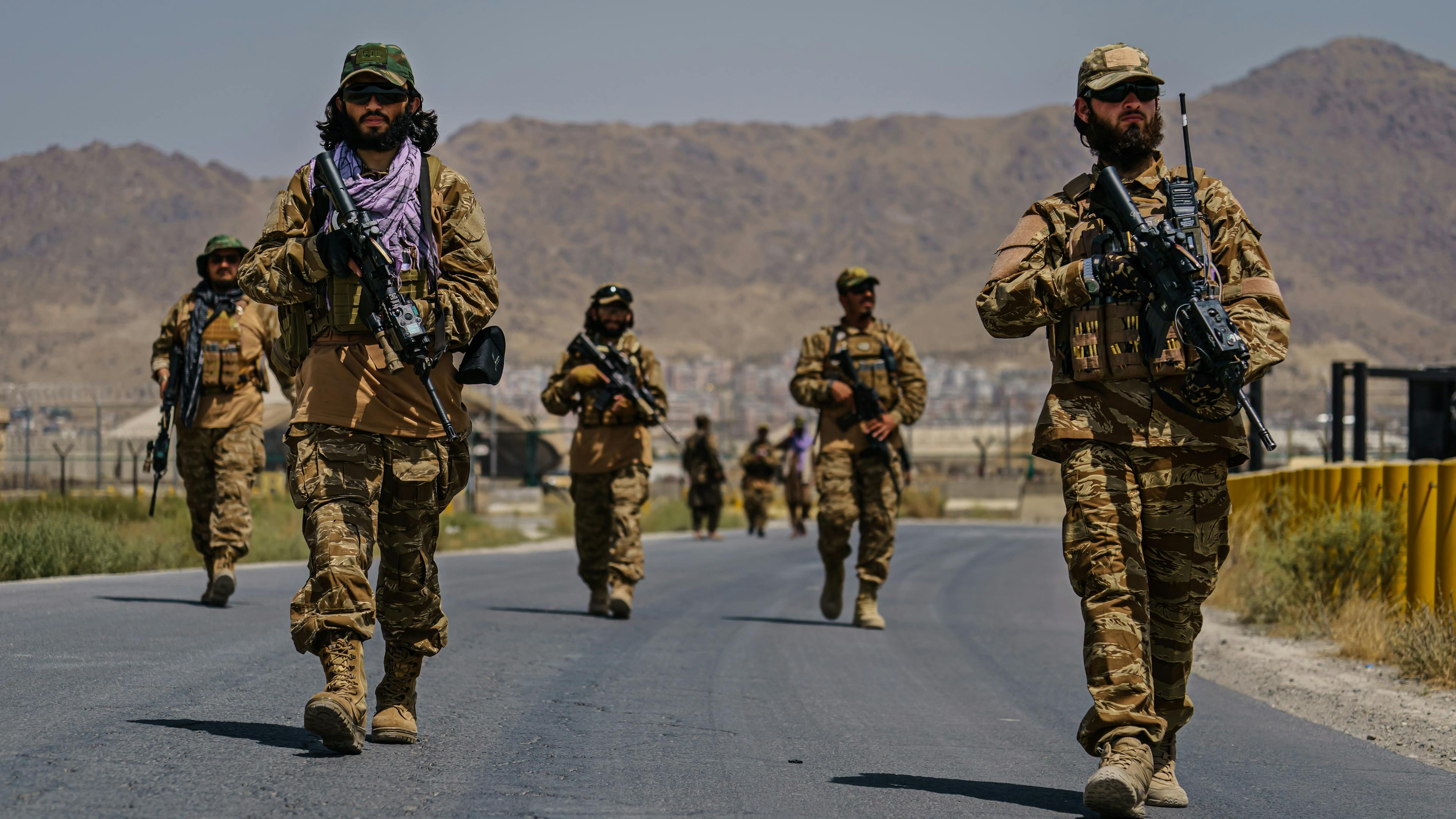 Taliban fighters secure the outer perimeter, alongside the American controlled side of of the Hamid Karzai International Airport in Kabul, Afghanistan, Sunday, Aug. 29, 2021.