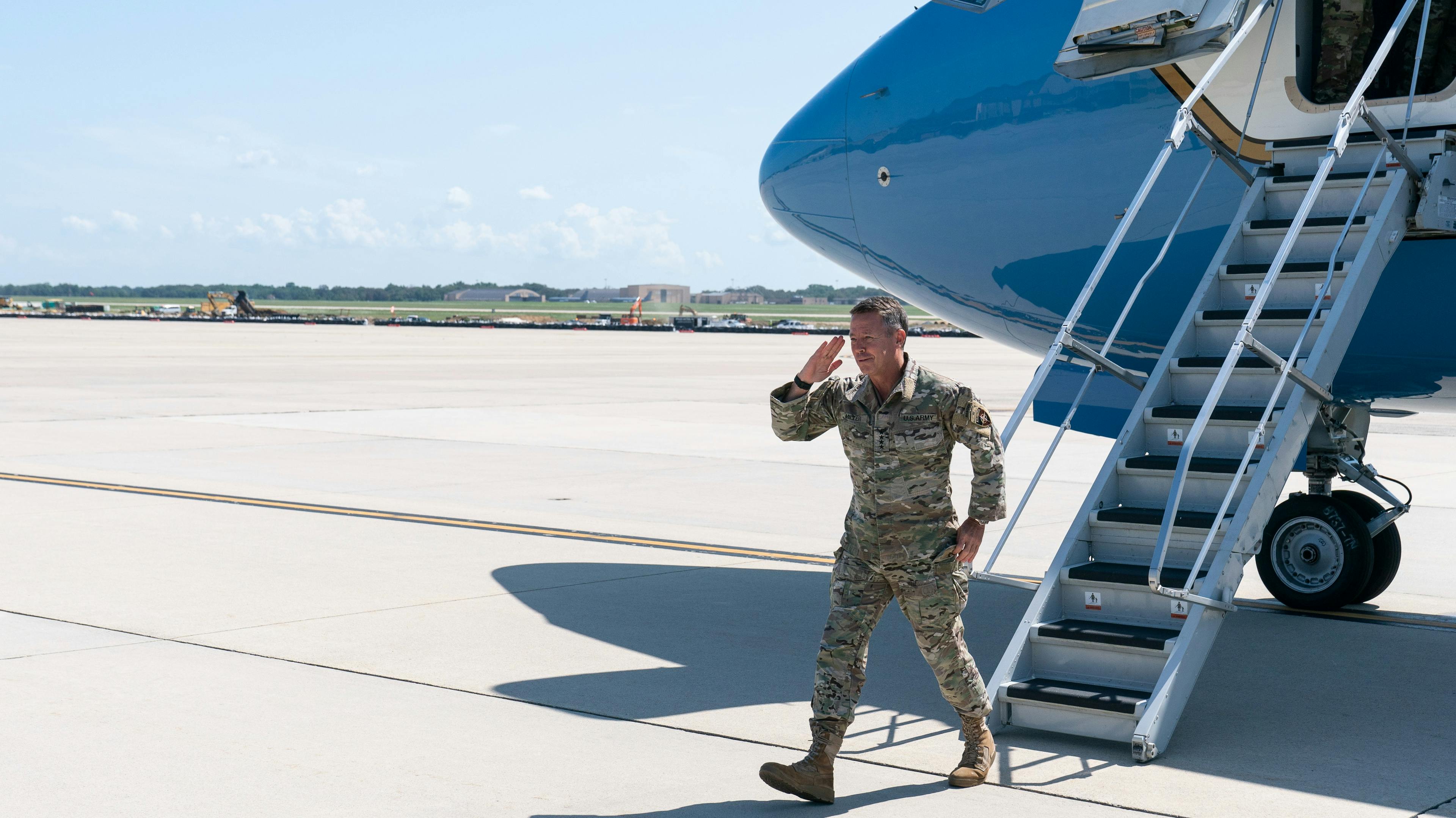 U.S. Army Gen. Scott Miller, the former top U.S. commander in Afghanistan, salutes Secretary of Defense Lloyd Austin and Joint Chiefs Chairman Gen. Mark Milley, upon his return on July 14, 2021 at Andrews Air Force Base, Maryland. 