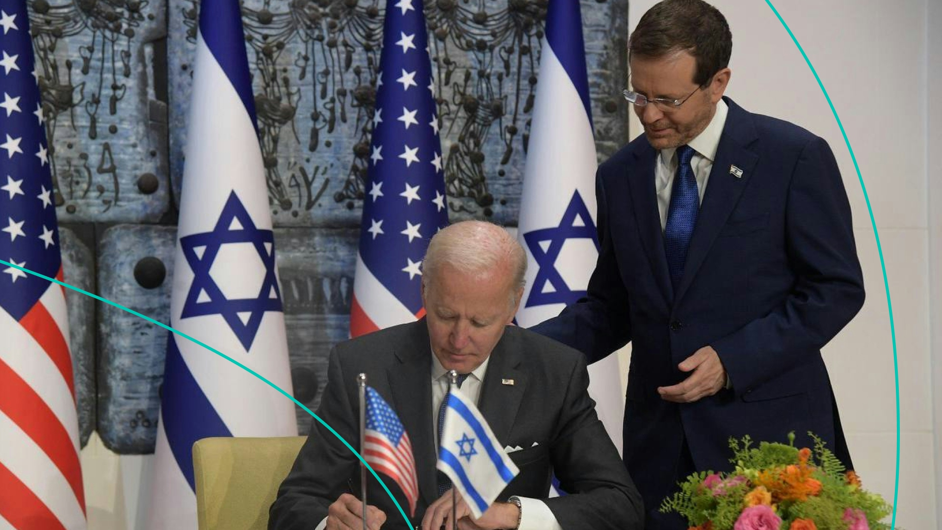 US President Joe Biden (L) signs the guestbook before talks with Israel's President Isaac Herzog (R)