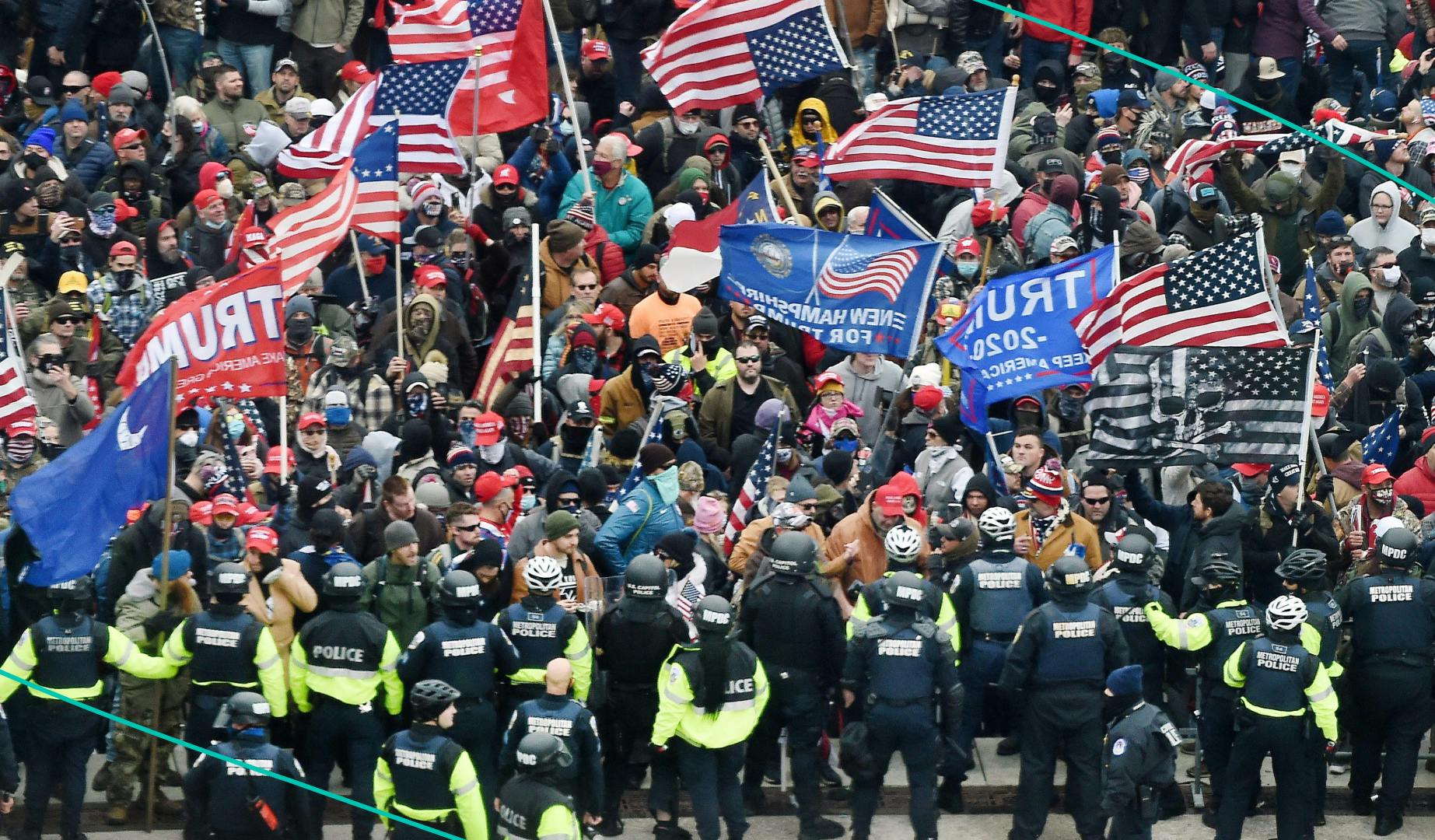 A mob of pro-Trump supporters clash with police as they storm the US Capitol in Washington, DC on January 6, 2021.