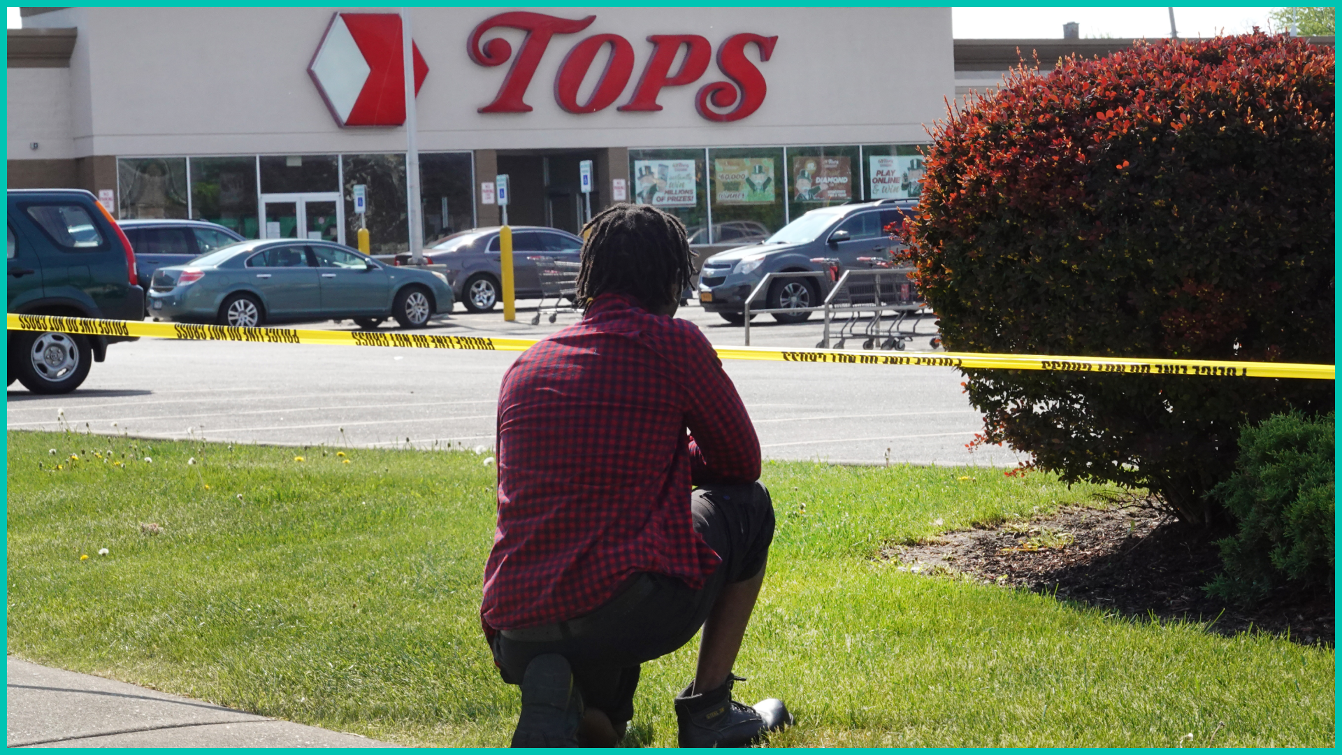 People gather outside of Tops market on May 15, 2022 in Buffalo, New York.