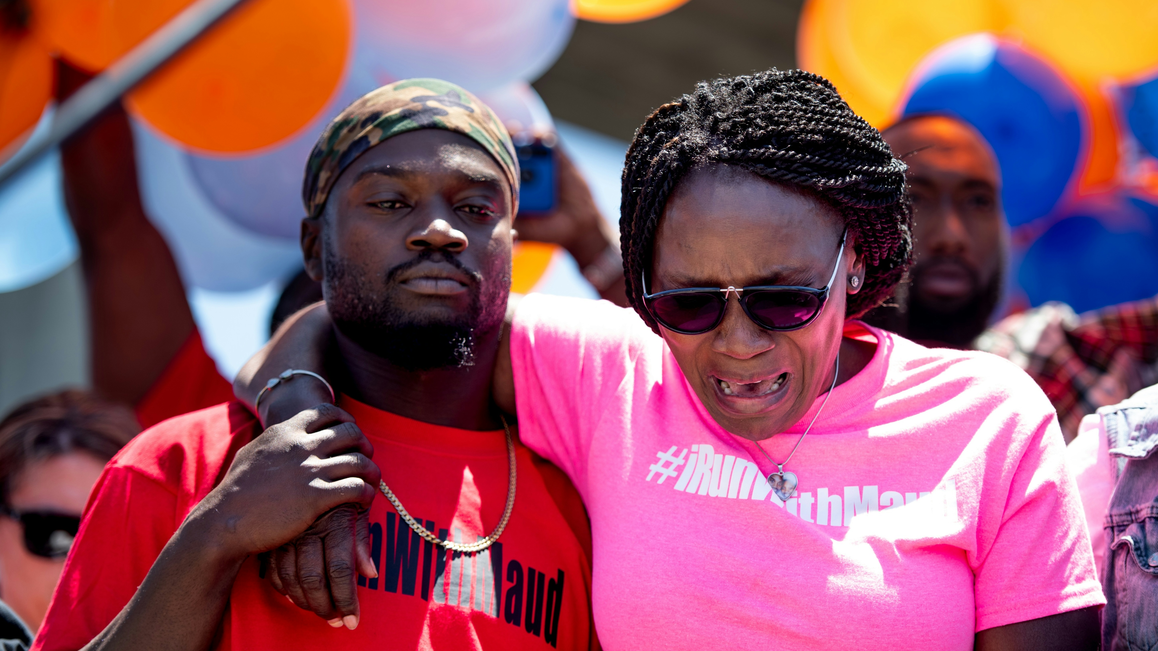 Wanda Cooper-Jones, mother of Ahmaud Arbery, weeps while people gather to honor her son at Sidney Lanier Park on May 9, 2020.