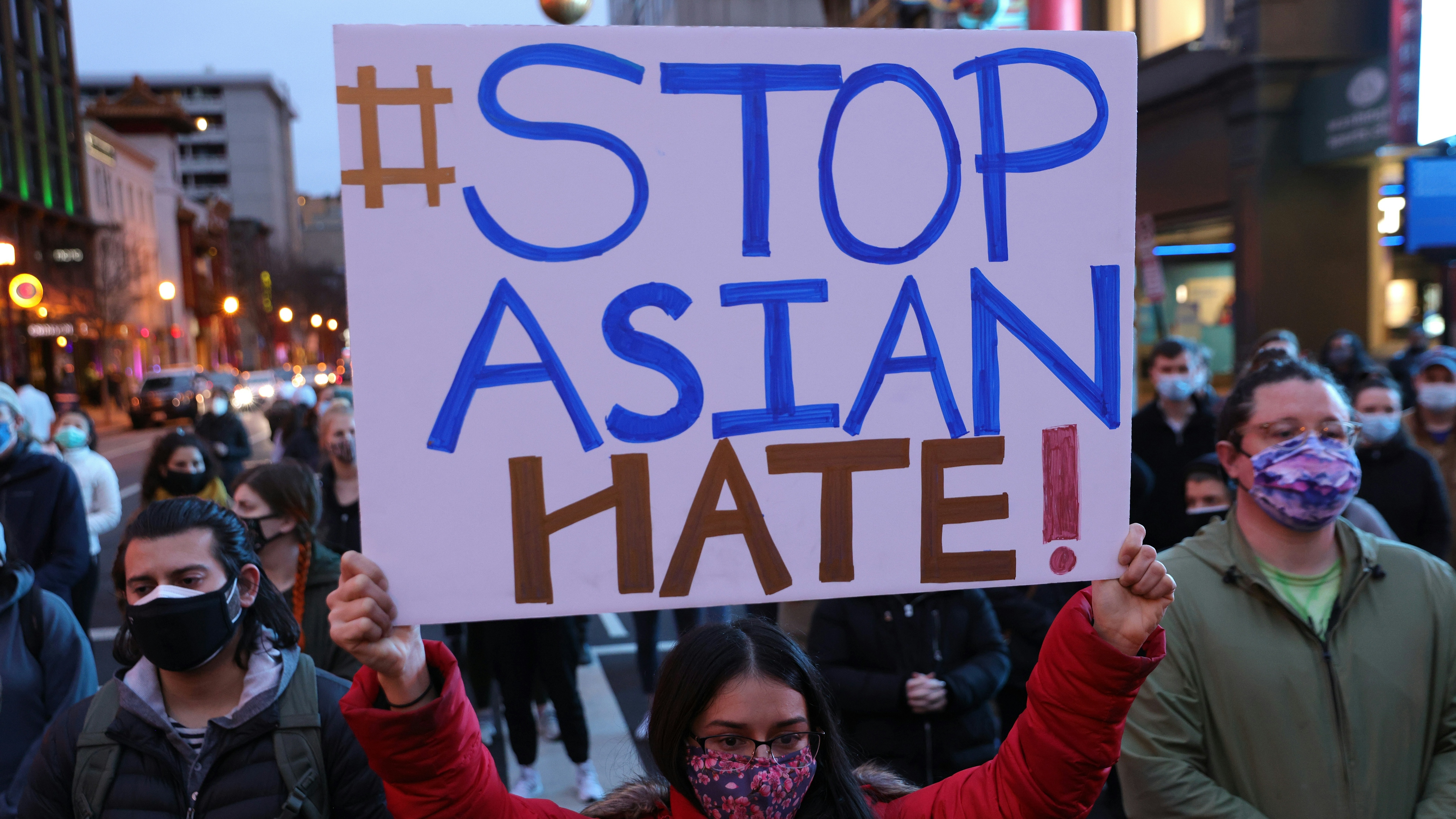 Activists participate in a vigil in response to the Atlanta spa shootings March 17, 2021 in the Chinatown area of Washington, DC.