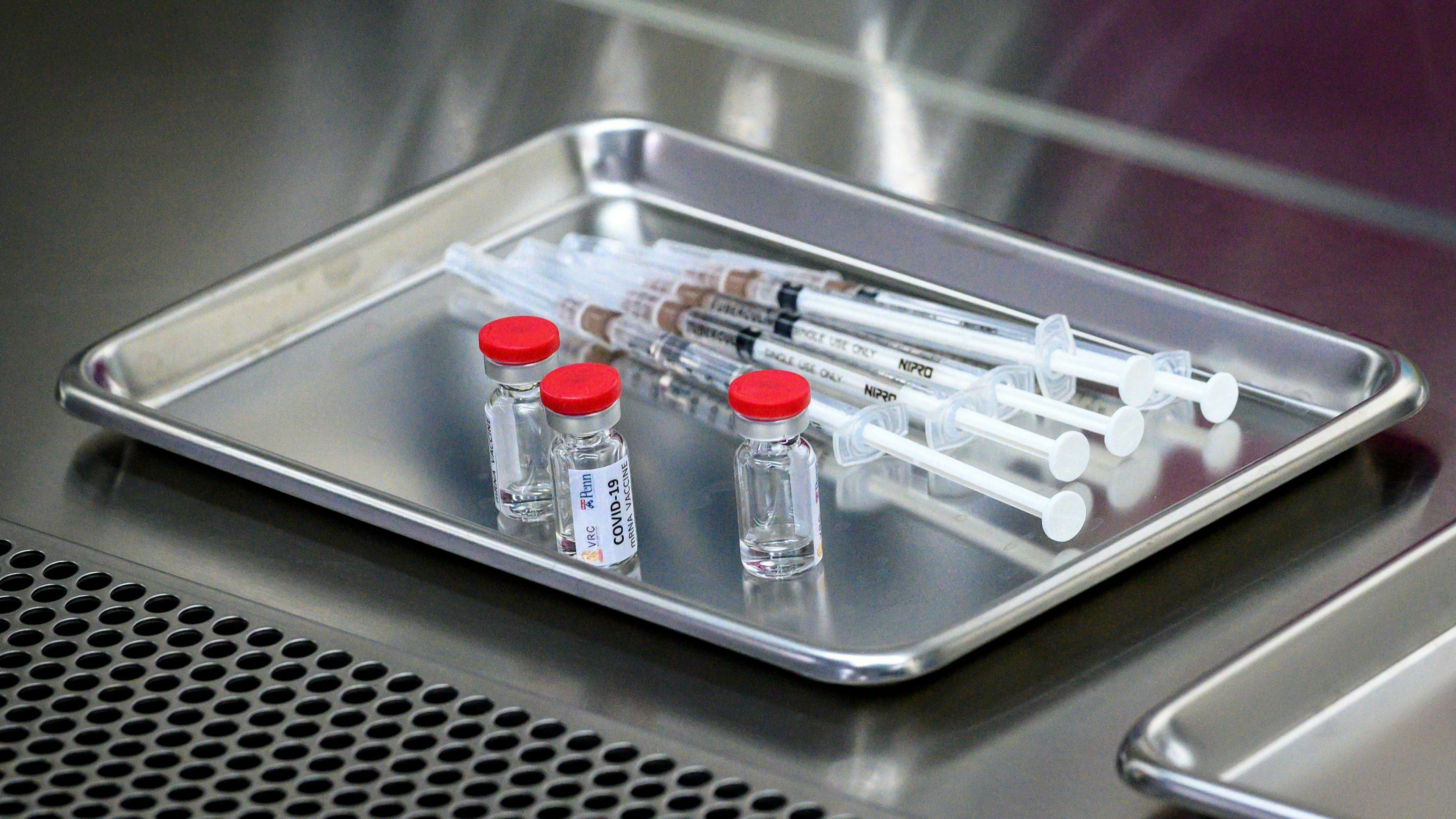 covid vaccine liquid and syringe
