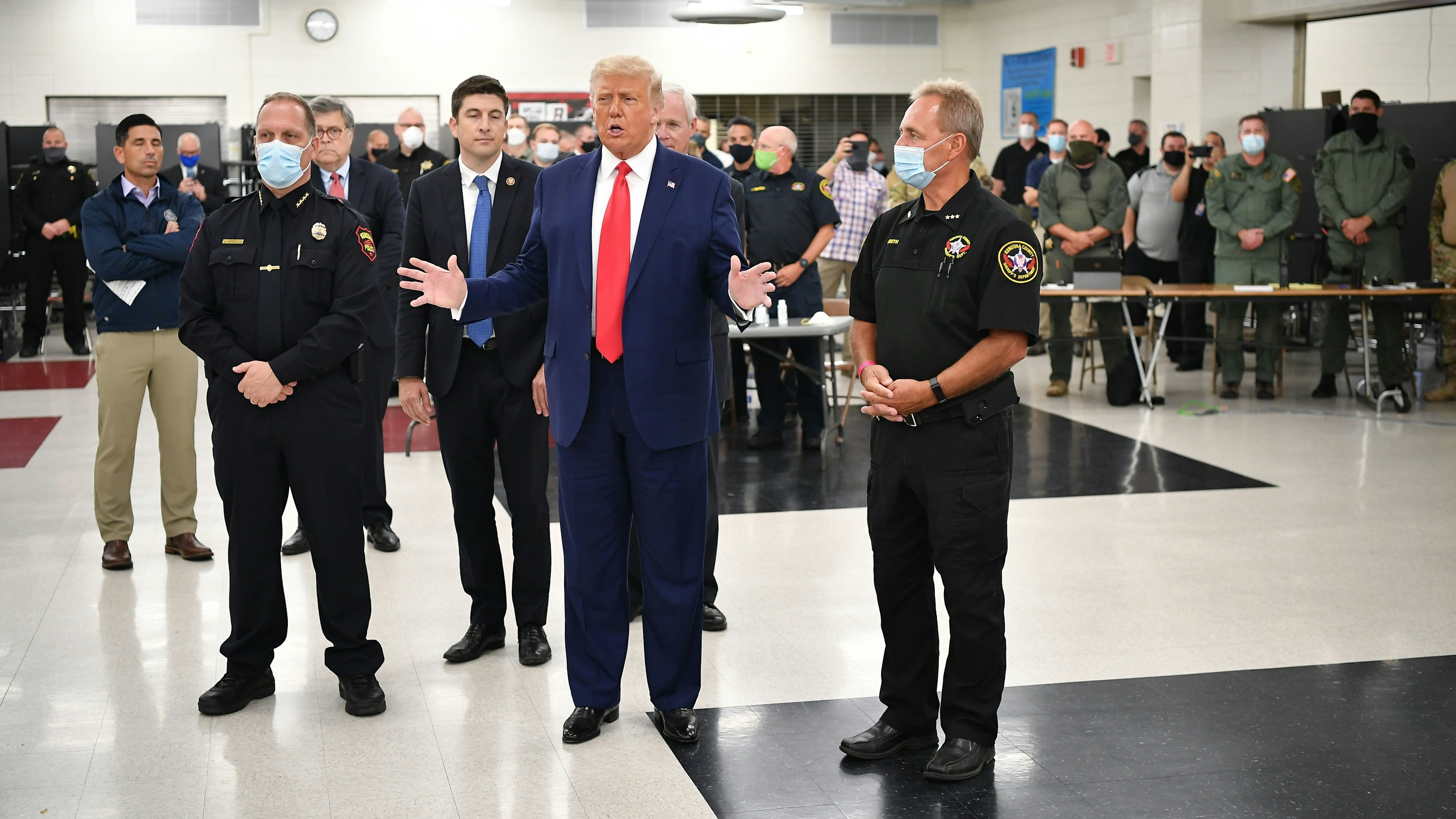 President Donald Trump speaks with officials on September 1, 2020, at Mary D. Bradford High School in Kenosha, Wisconsin