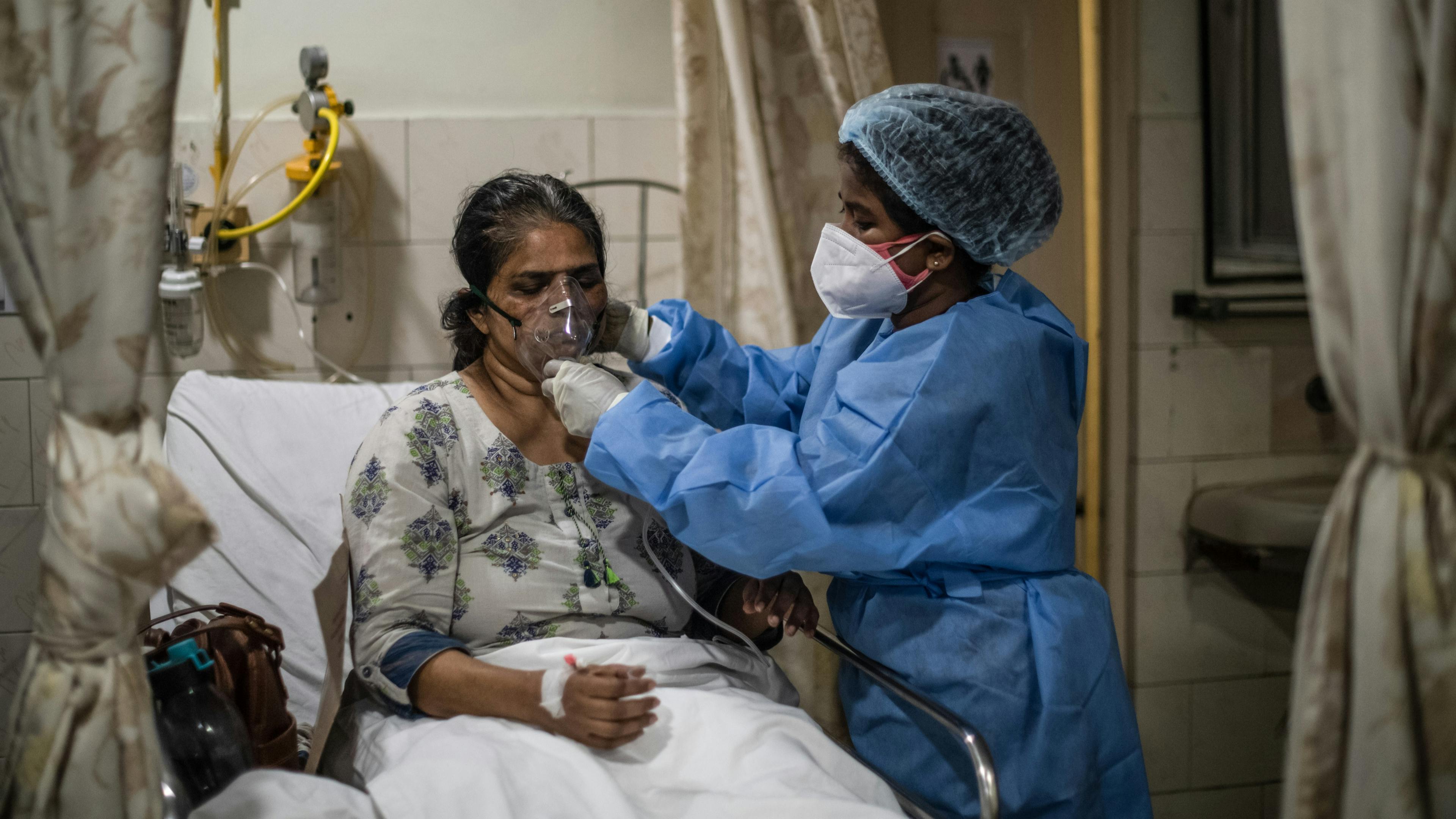 Medical staff attend to Covid-19 positive patients in the emergency ward in New Delhi, India.
