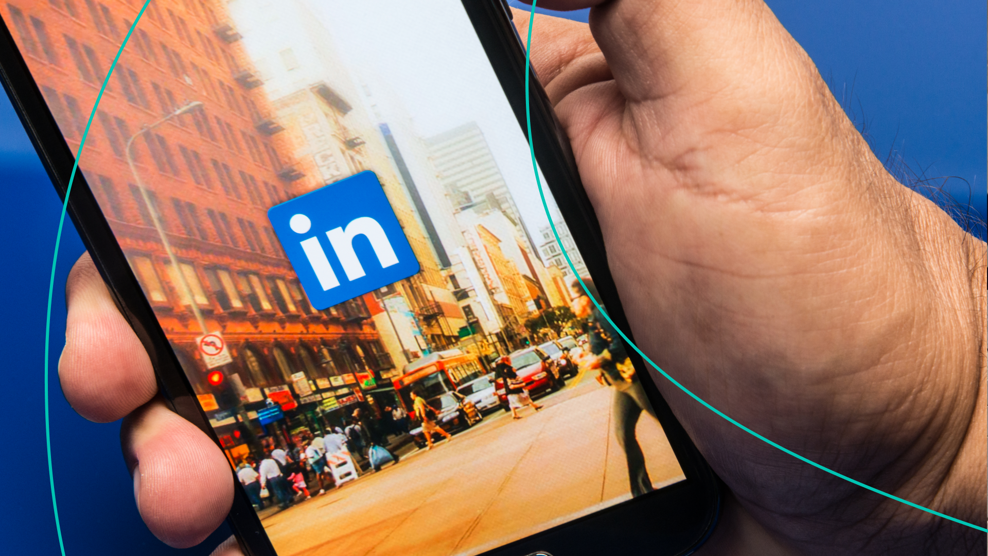 Hand holding phone with LinkedIn app open