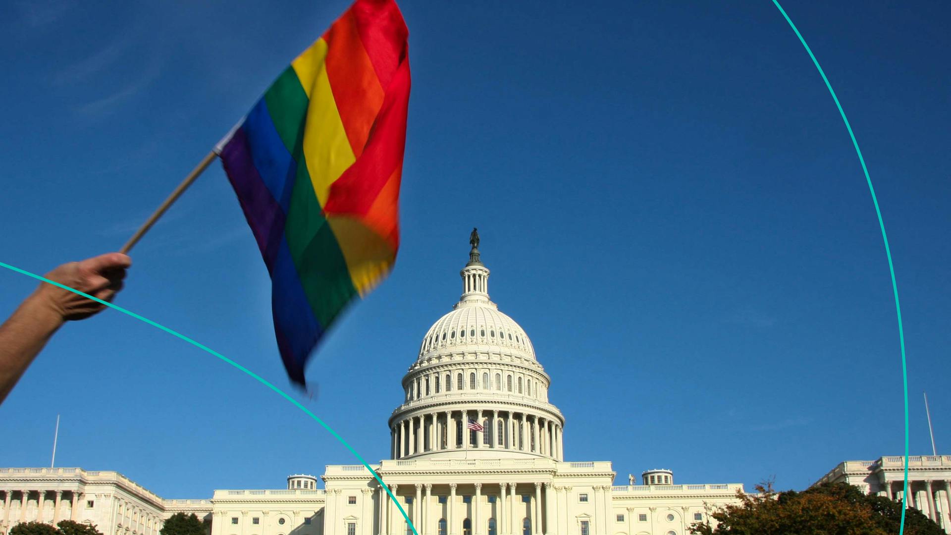 The Pride flag in front of the capitol building