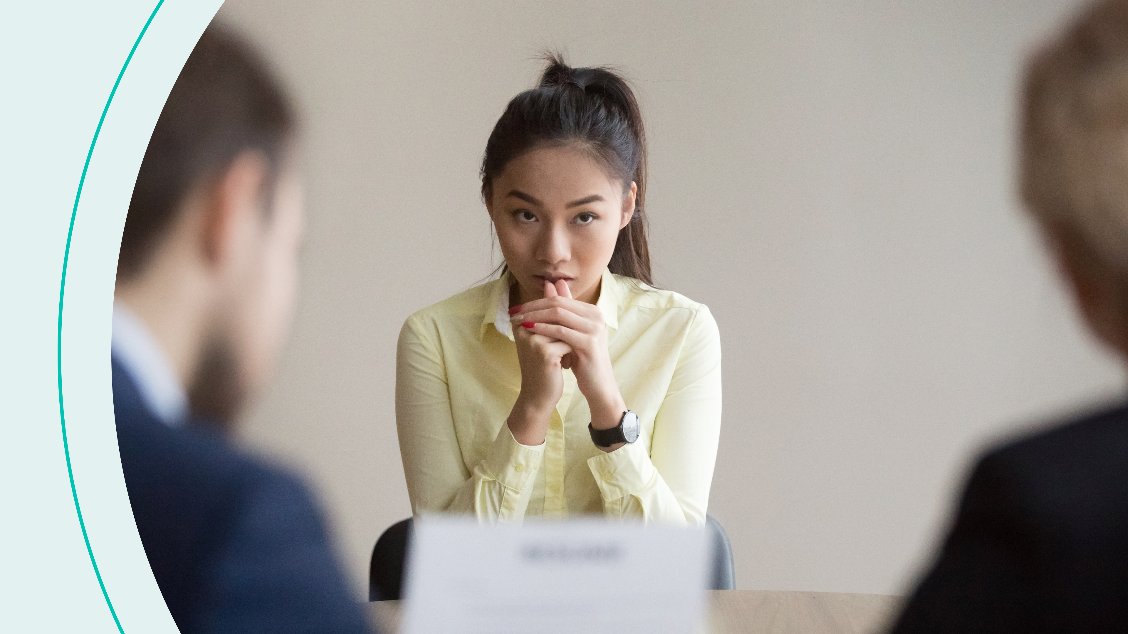 woman sitting pensively at negotiation table