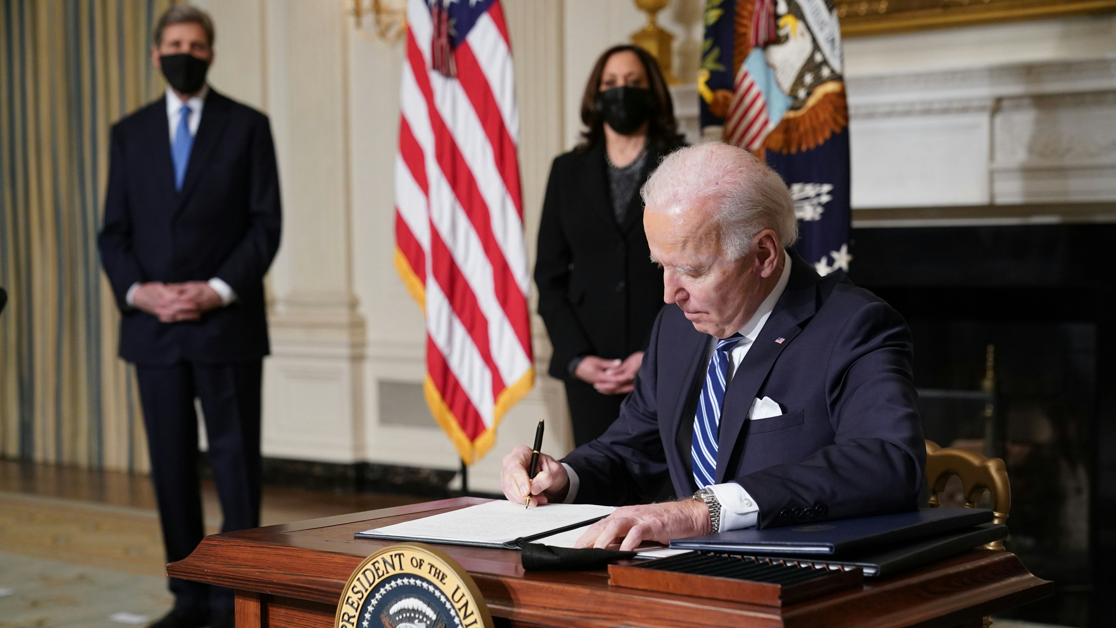 Biden signing executive orders on climate change on January 27, 2021.