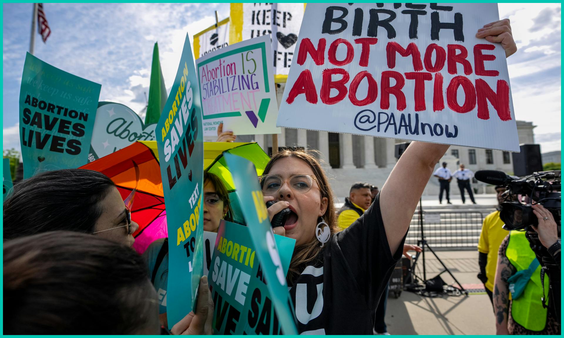 Abortion rights and anti-abortion supporters clash outside the Supreme Court