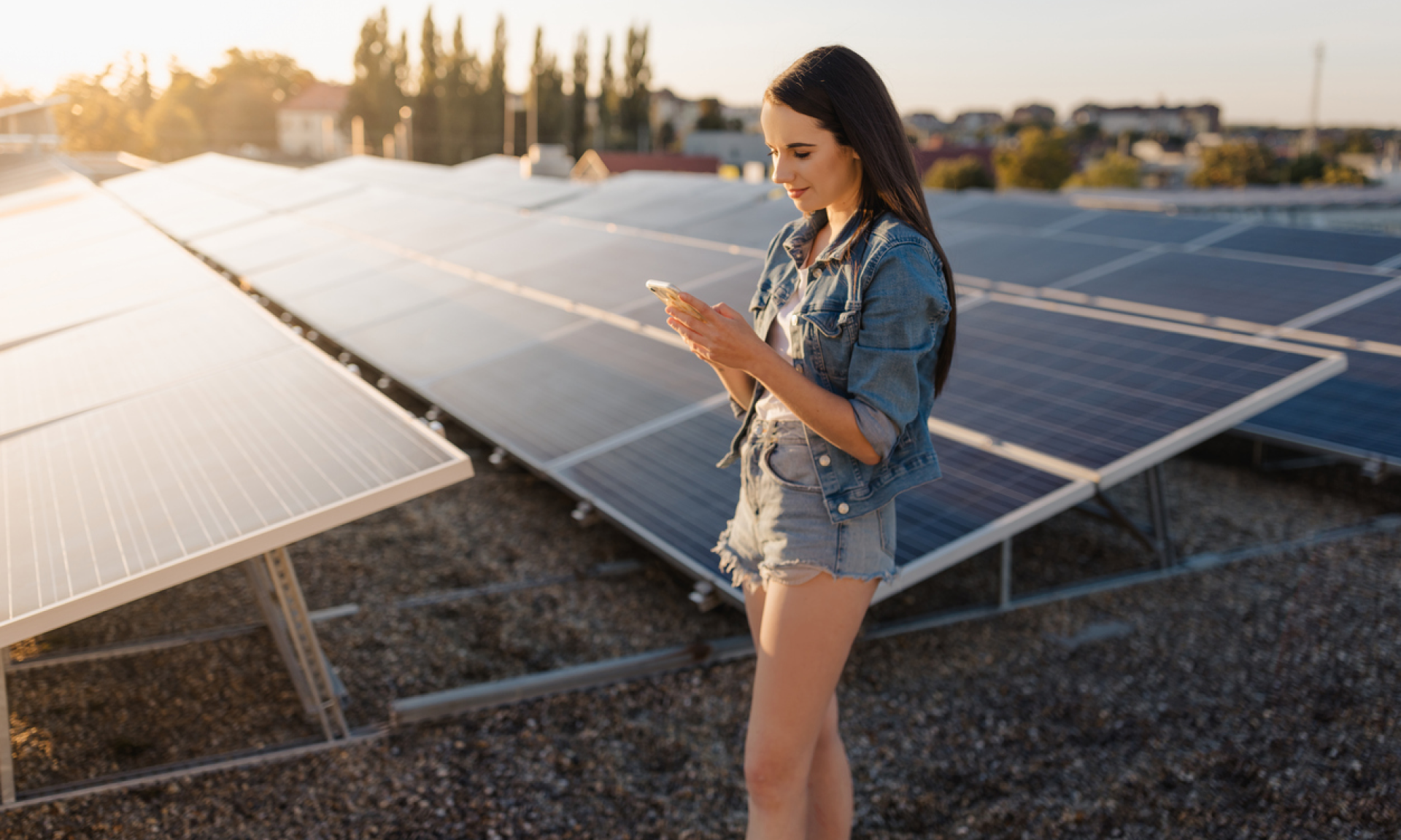 woman standing in front of solar panels