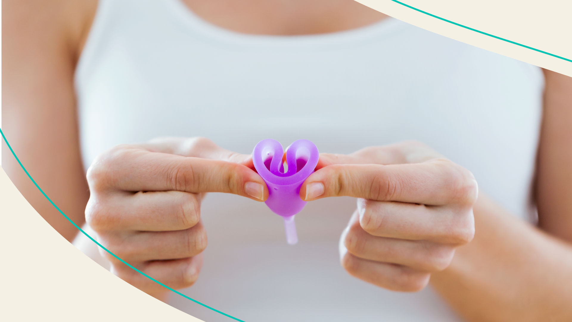 Person holding a menstrual cup folded in half
