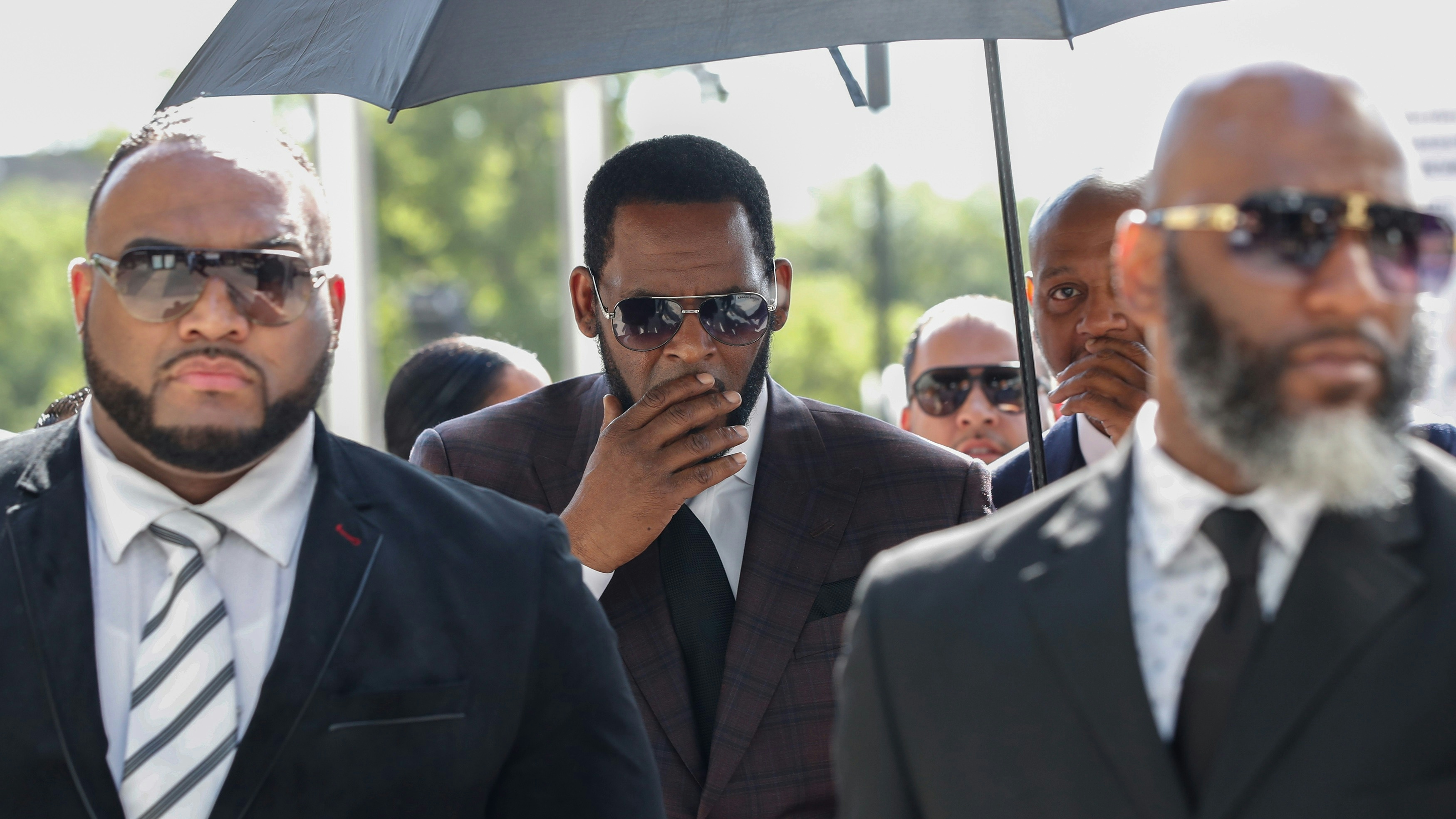 R. Kelly arrives for a hearing on sexual abuse charges