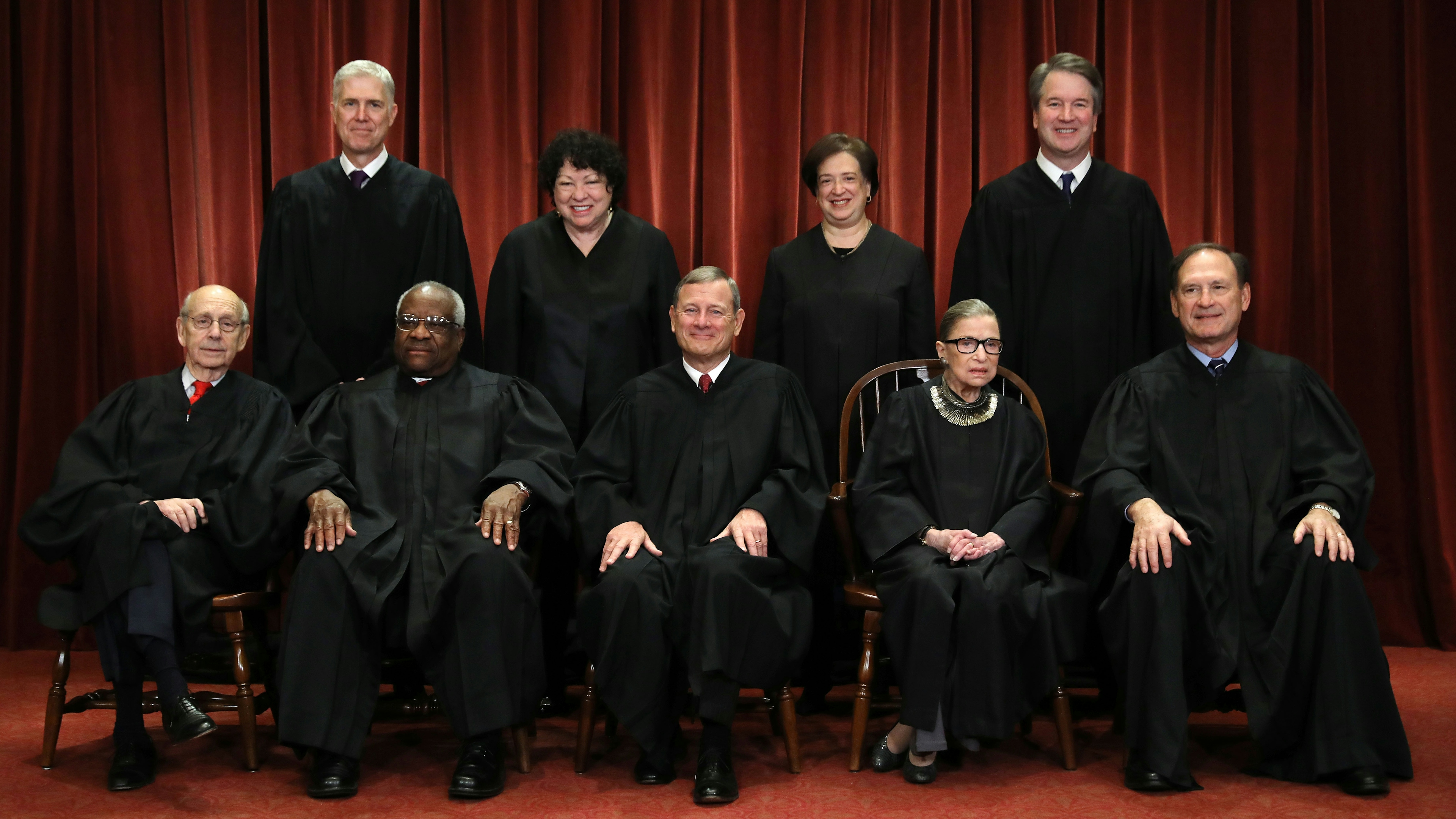 Justices pose for their official portrait at the in the East Conference Room at the Supreme Court building November 30, 2018