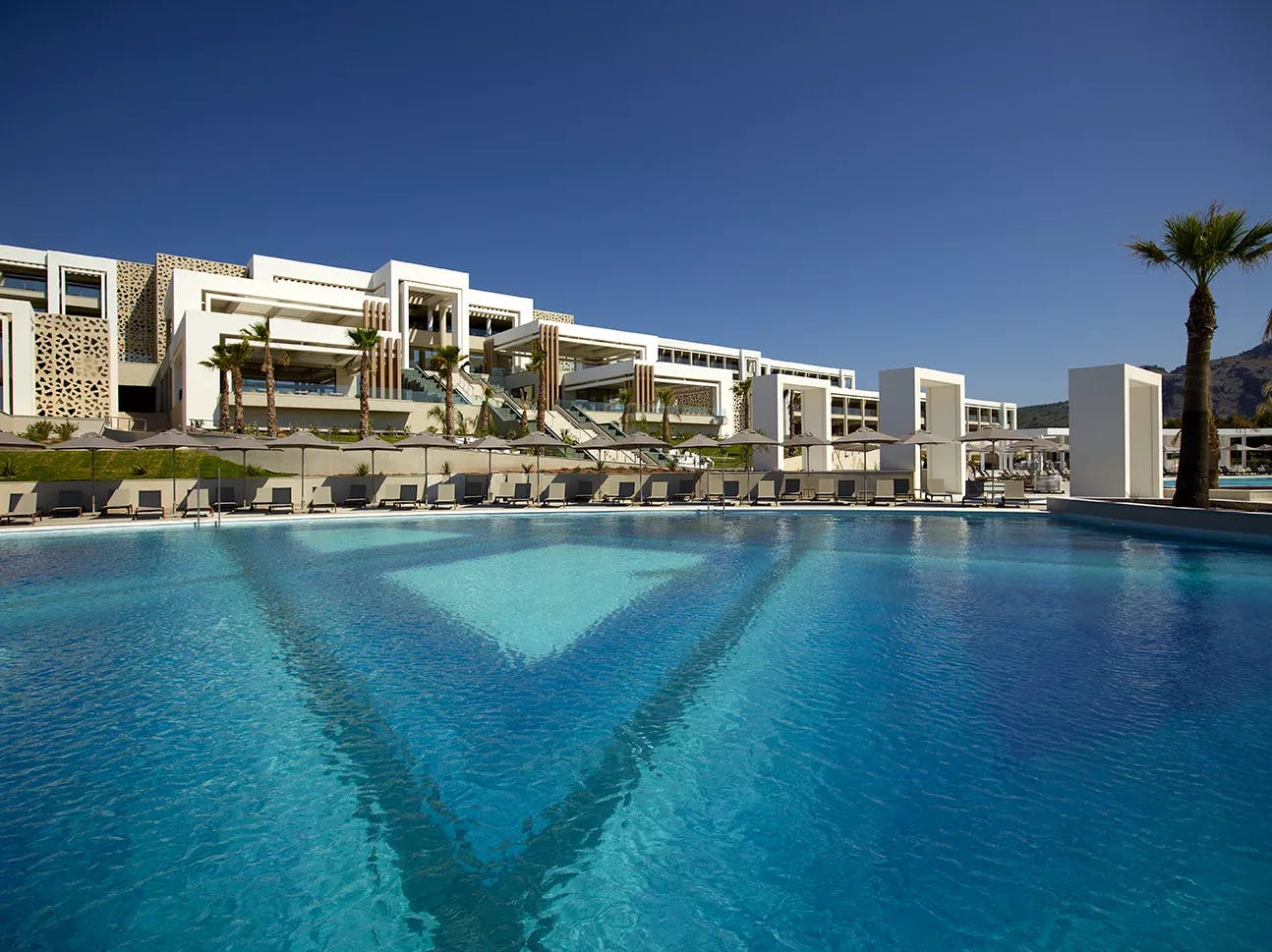 Resort overlooking a pool 