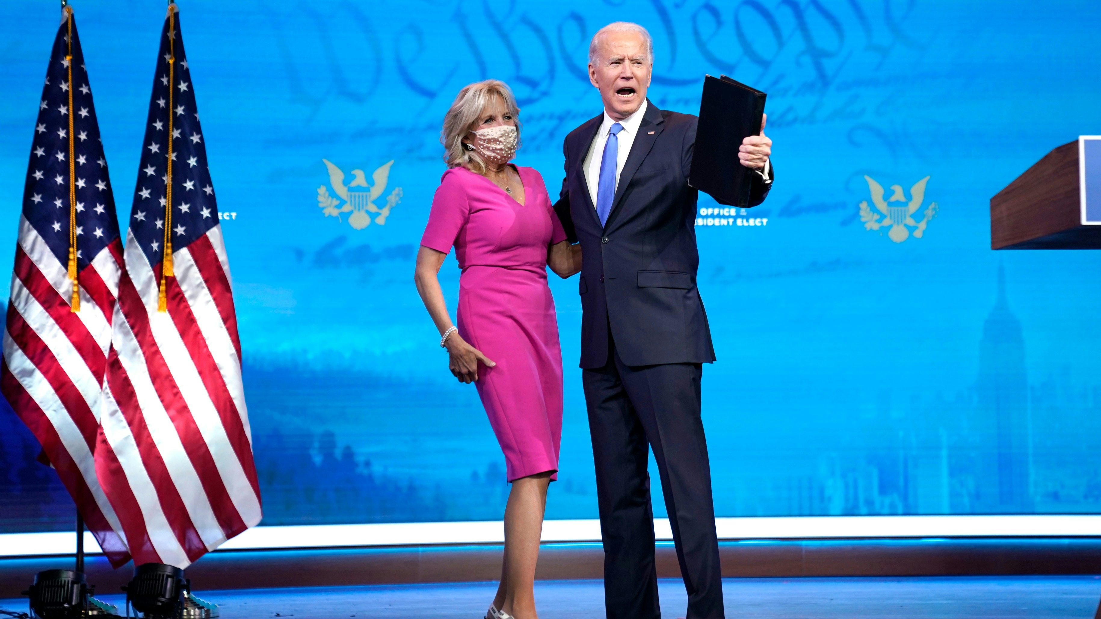 President-elect Joe Biden embraces his wife Dr. Jill Biden after speaking about the Electoral College vote. certification process at The Queen theater on December 14, 2020 in Wilmington, Delaware.