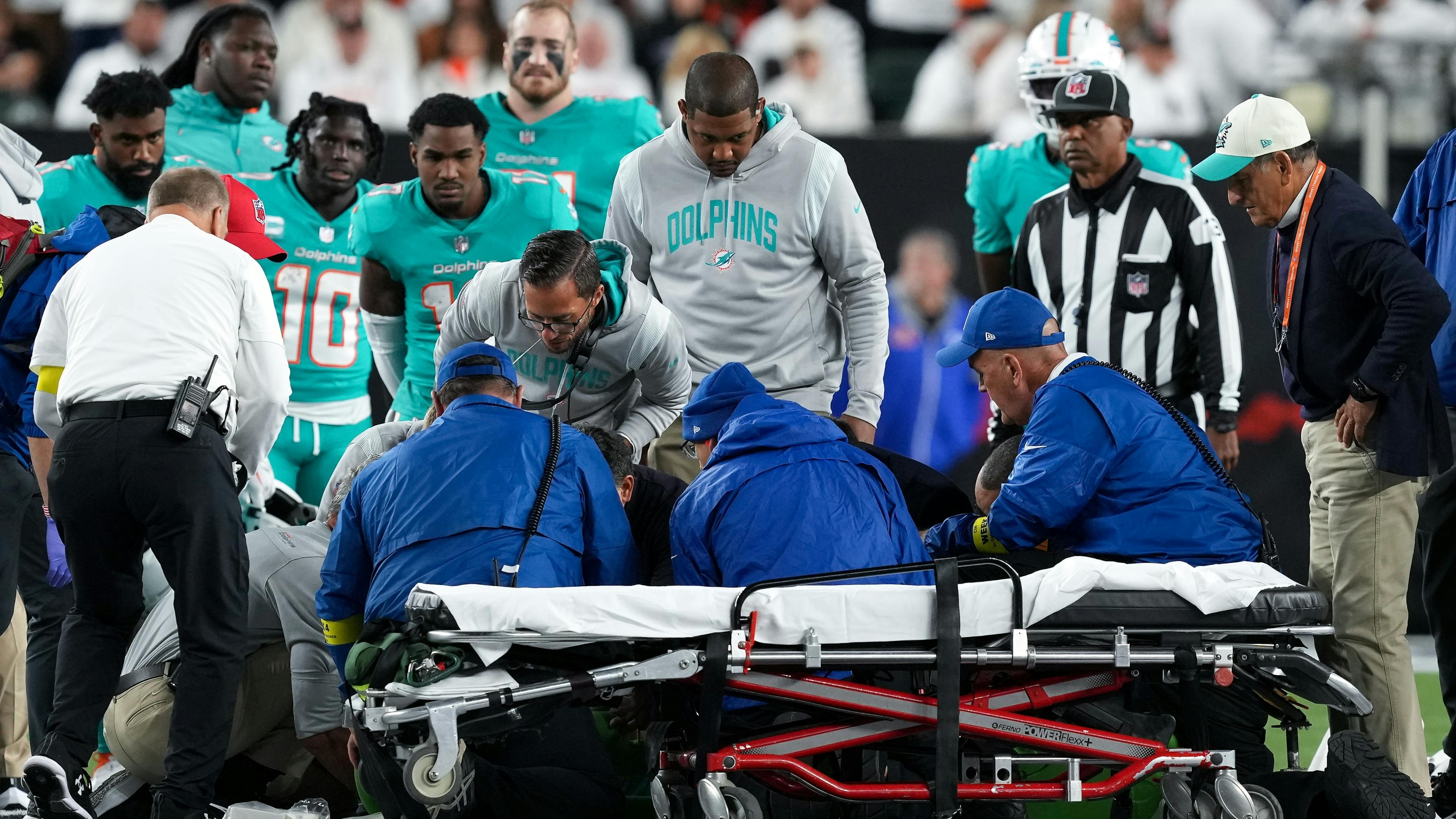 Dolphin's quarterback seeking medical attention on the field