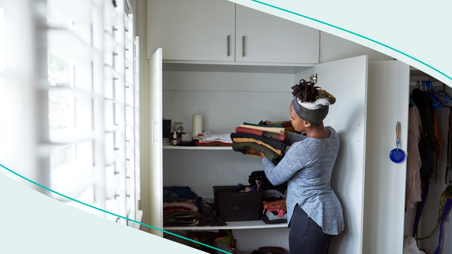 Women putting clothes in closet with teal graphic
