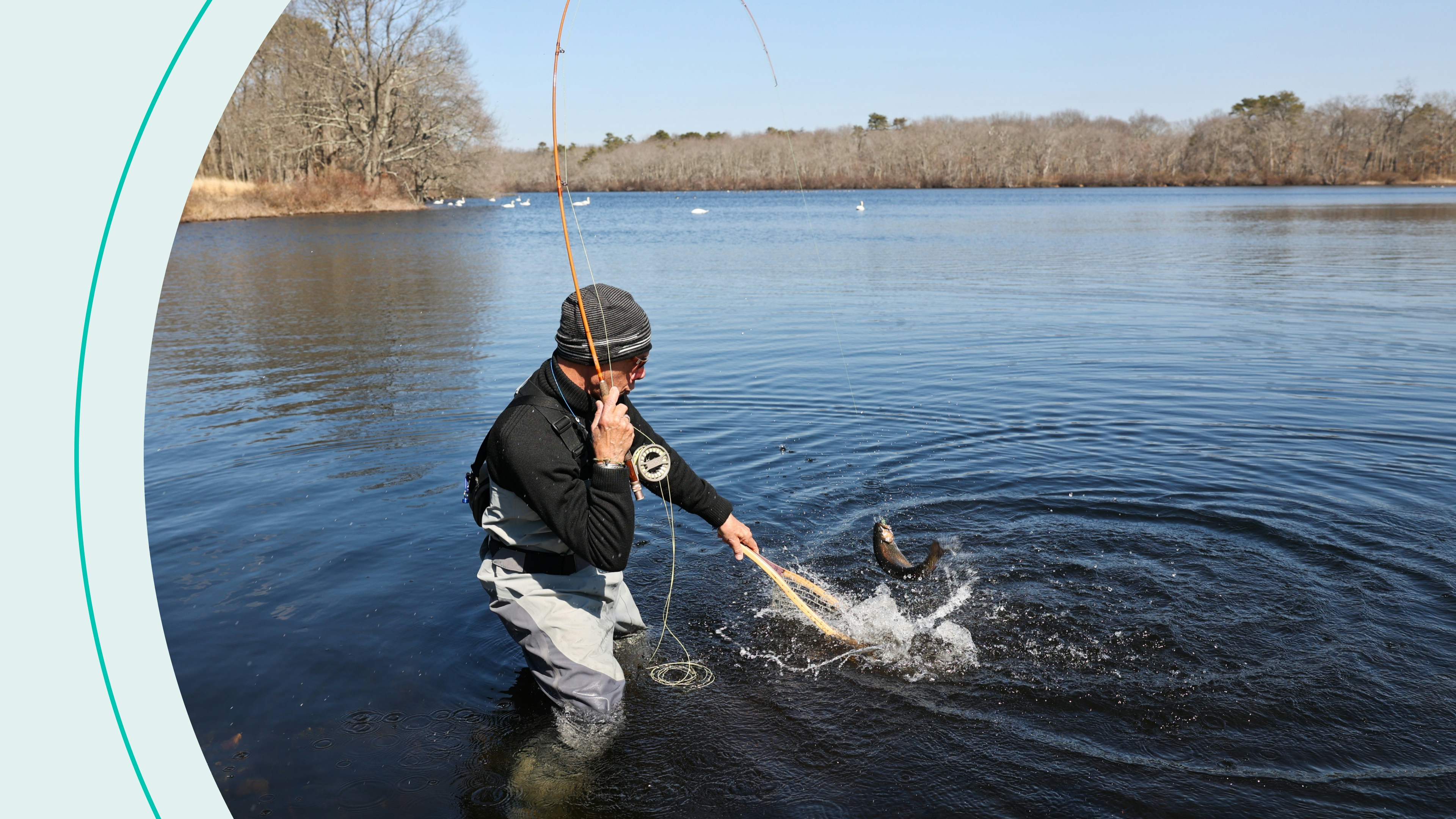 Man  catches a brook trout in the main pond at Connetquot River State Park Preserve in Oakdale, New York, on March 16, 2022