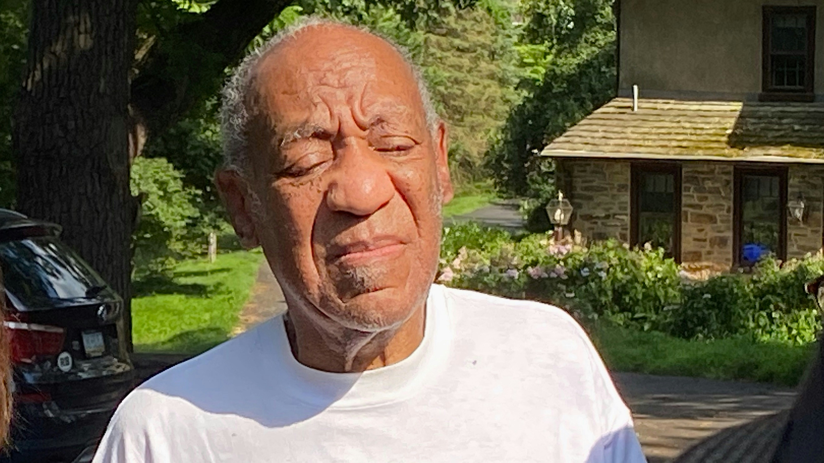 Bill Cosby speaks to reporters outside of his home.