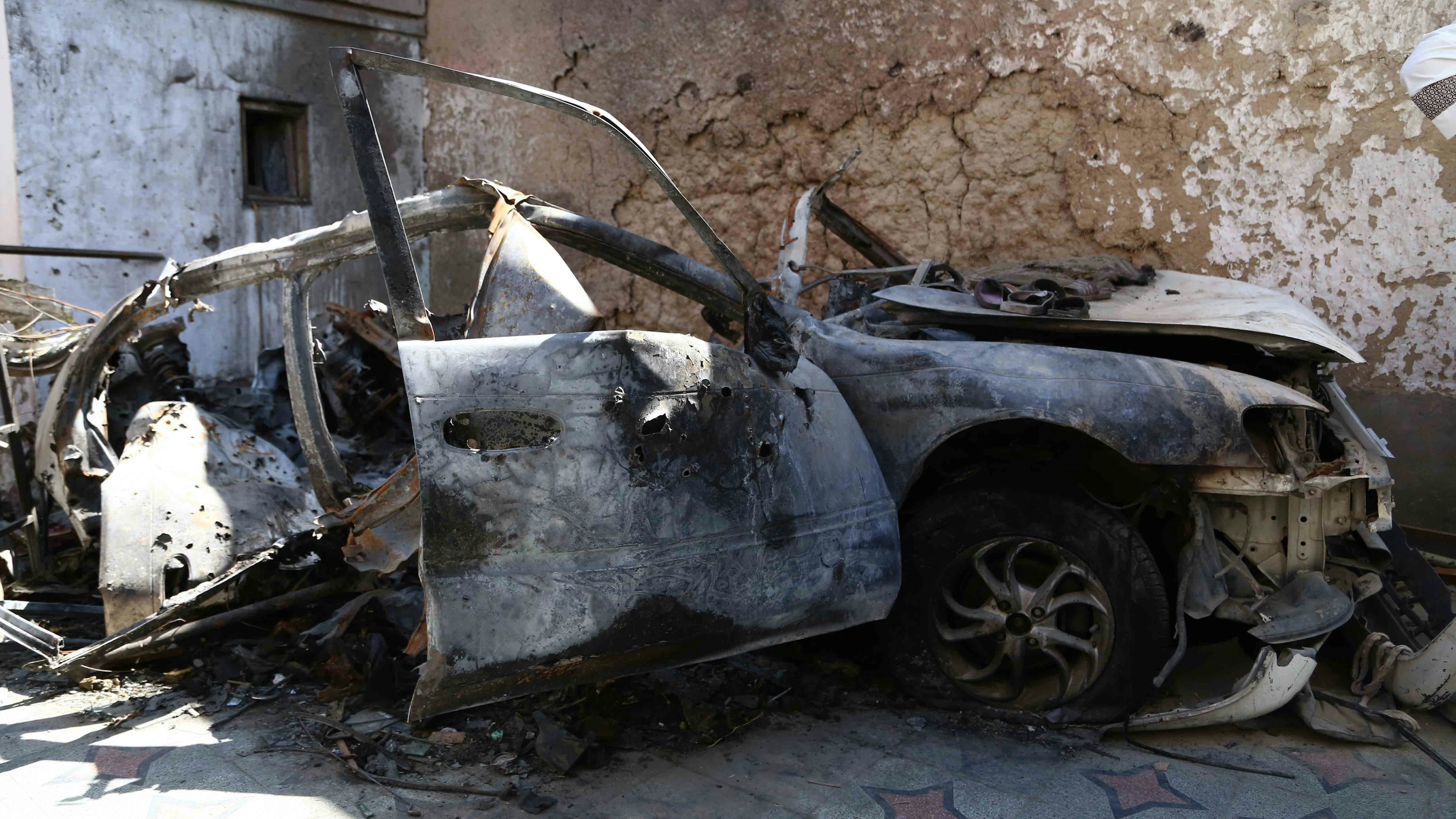 A damaged vehicle at a site of U.S. drone strike in Kabul, capital of Afghanistan