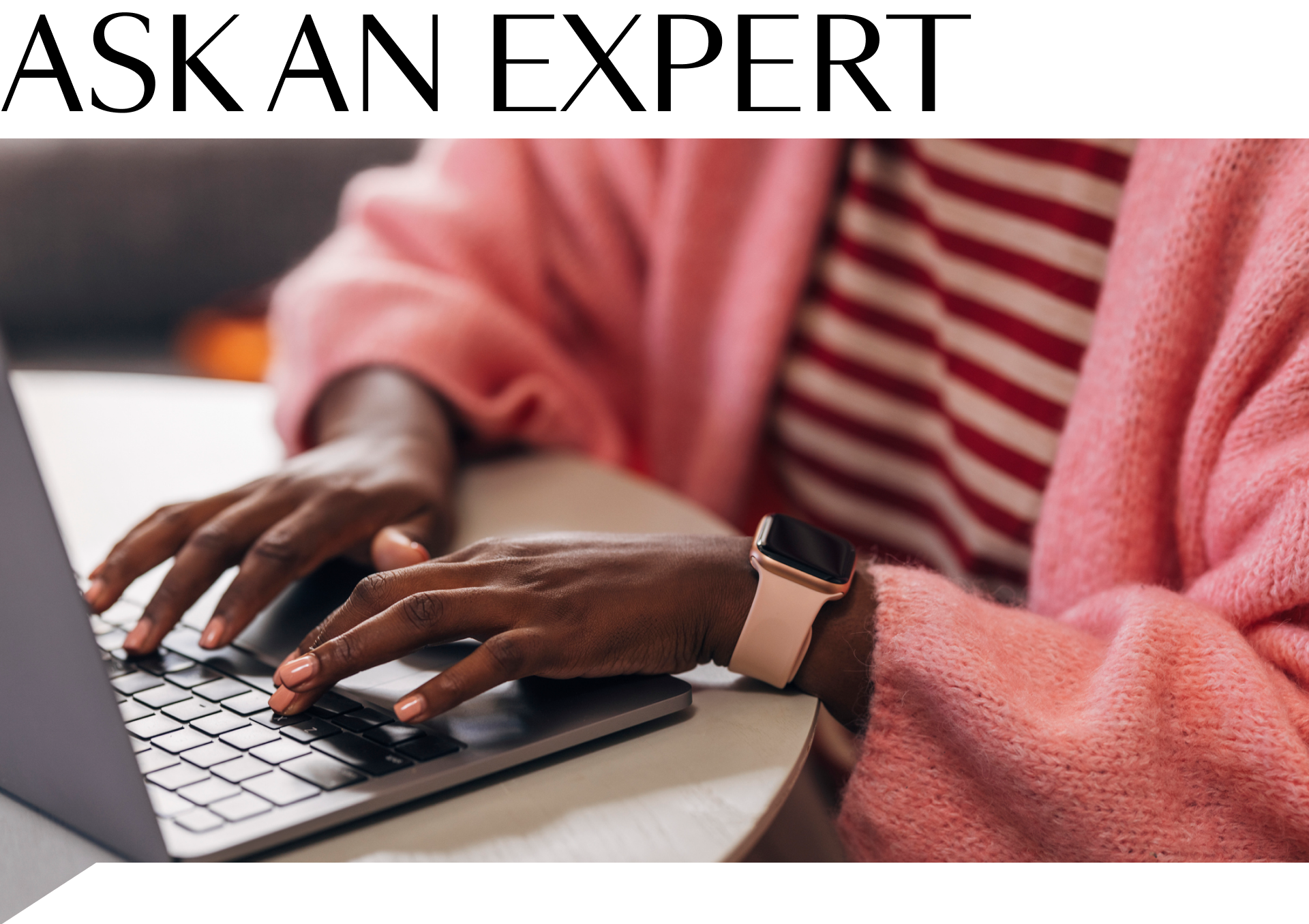 ask an expert text and stock image of hands typing on a laptop