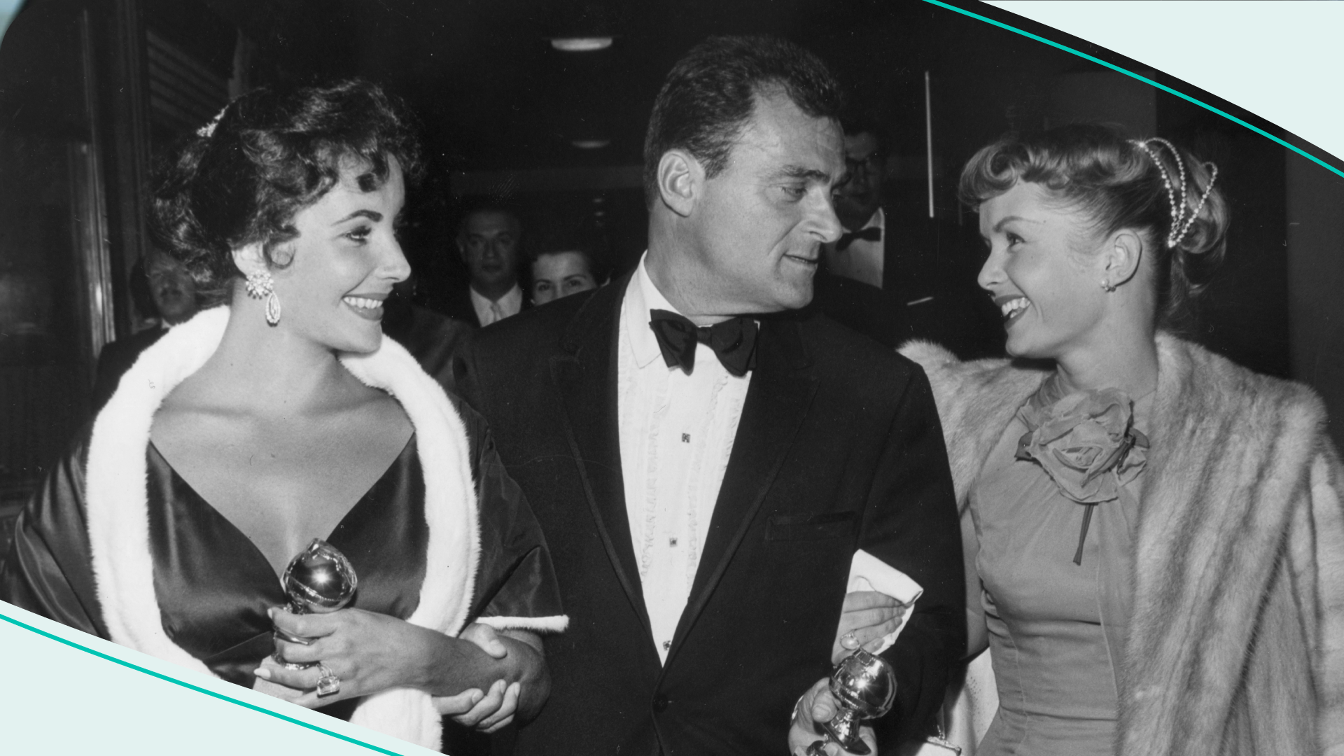 28th February 1957: From left to right, British-born actor Elizabeth Taylor and her husband, film producer Mike Todd (1909 - 1958), hold their Golden Globe awards while walking with American actor Debbie Reynolds.