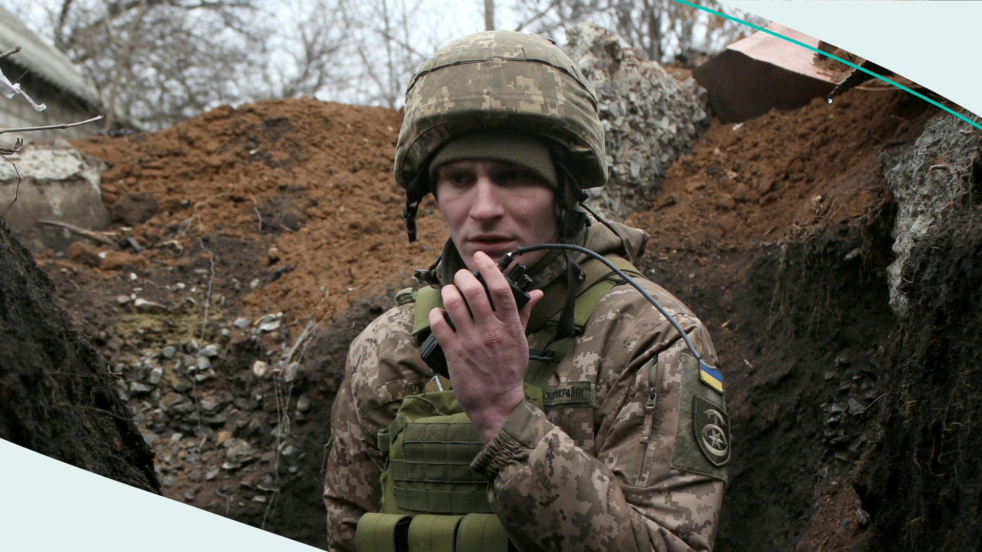 A serviceman of Ukrainian Military Forces speaks as he keeps position on the front line with Russia backed separatists, near Novolugansk, in the Donetsk region, on February 17, 2022