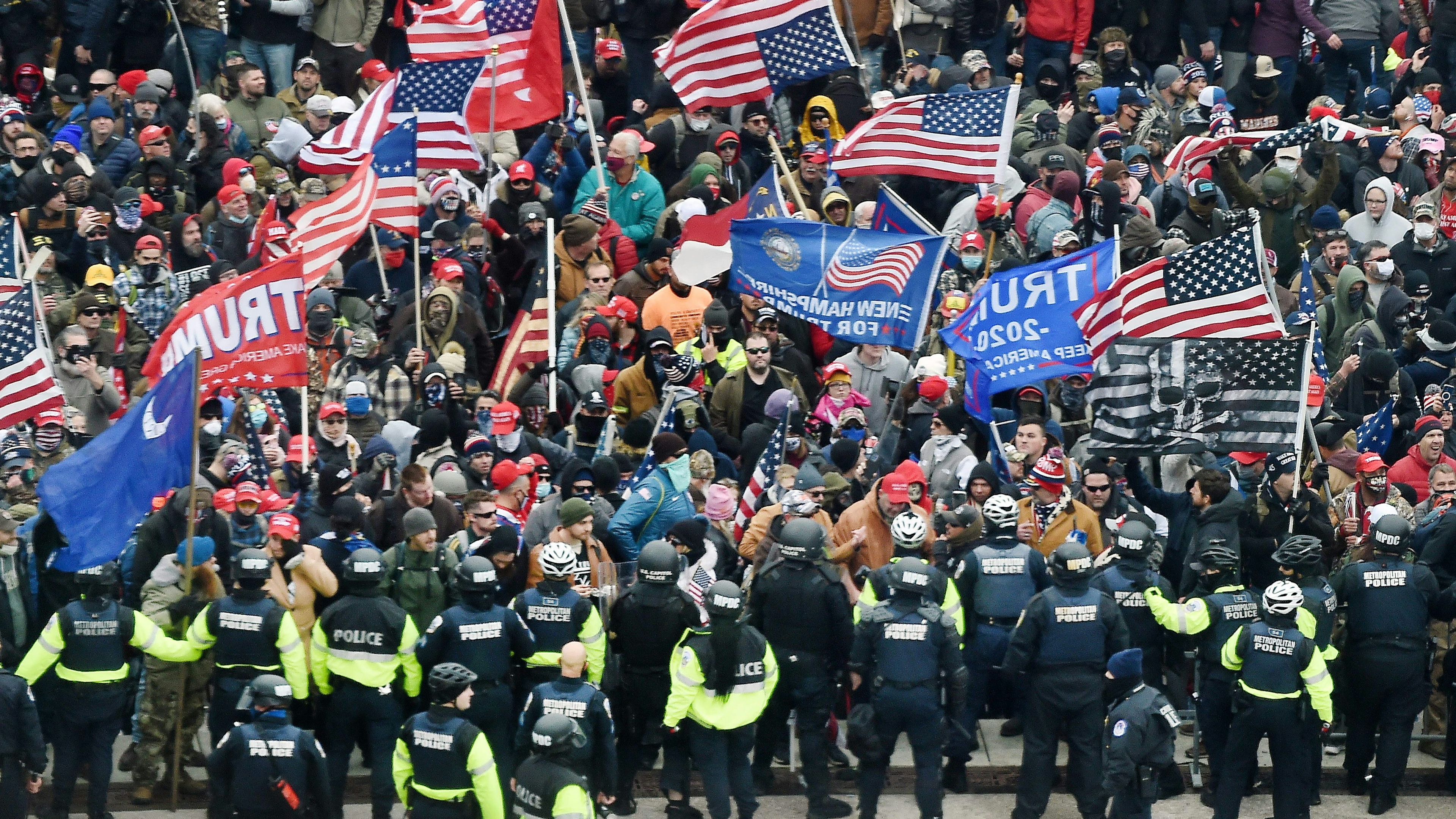 Trump supporters clash with police and security forces as they storm the US Capitol in Washington, DC on January 6, 2021.