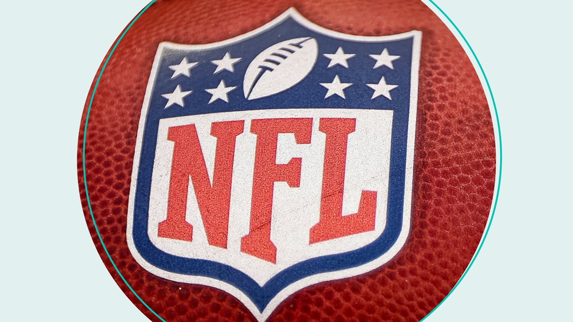 A general view of the NFL logo on a football before the game between the Washington Commanders and the Philadelphia Eagles at FedExField on September 25, 2022