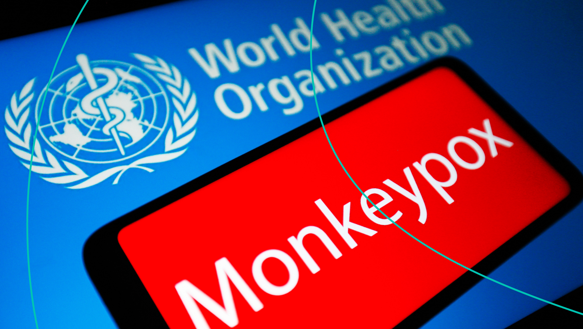 World Health Organization and a phone with Monkeypox written on it