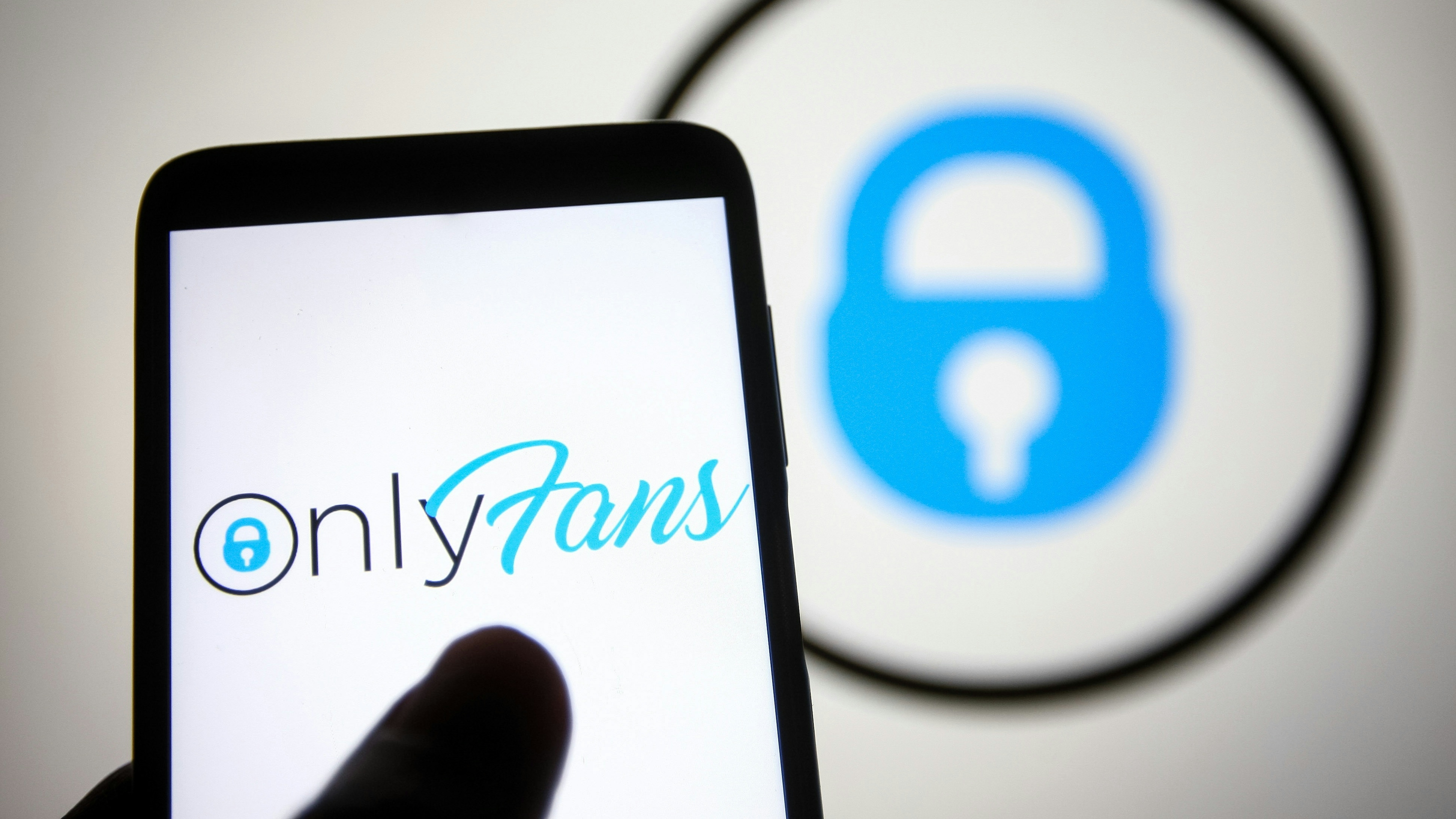 In this photo illustration, an OnlyFans logo seen displayed on a smartphone