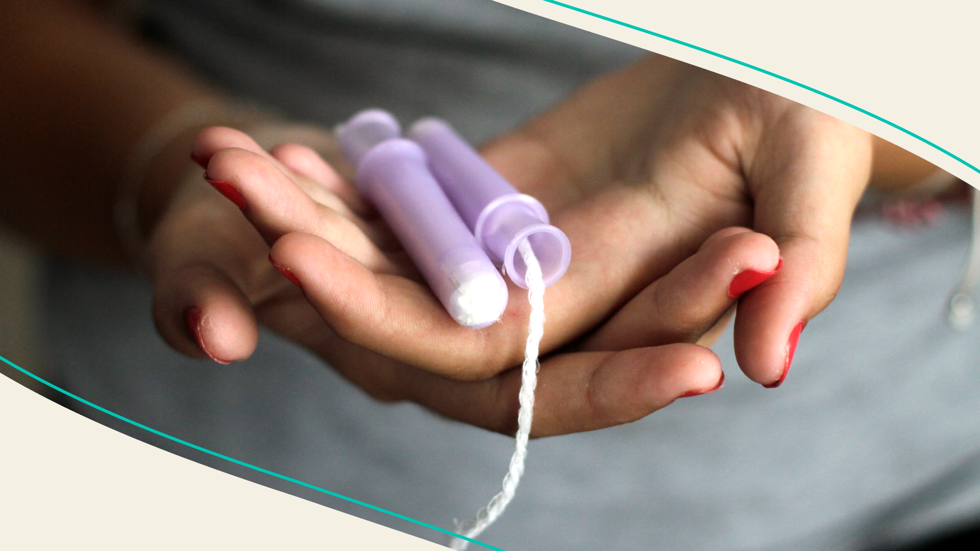 Woman holds tampon