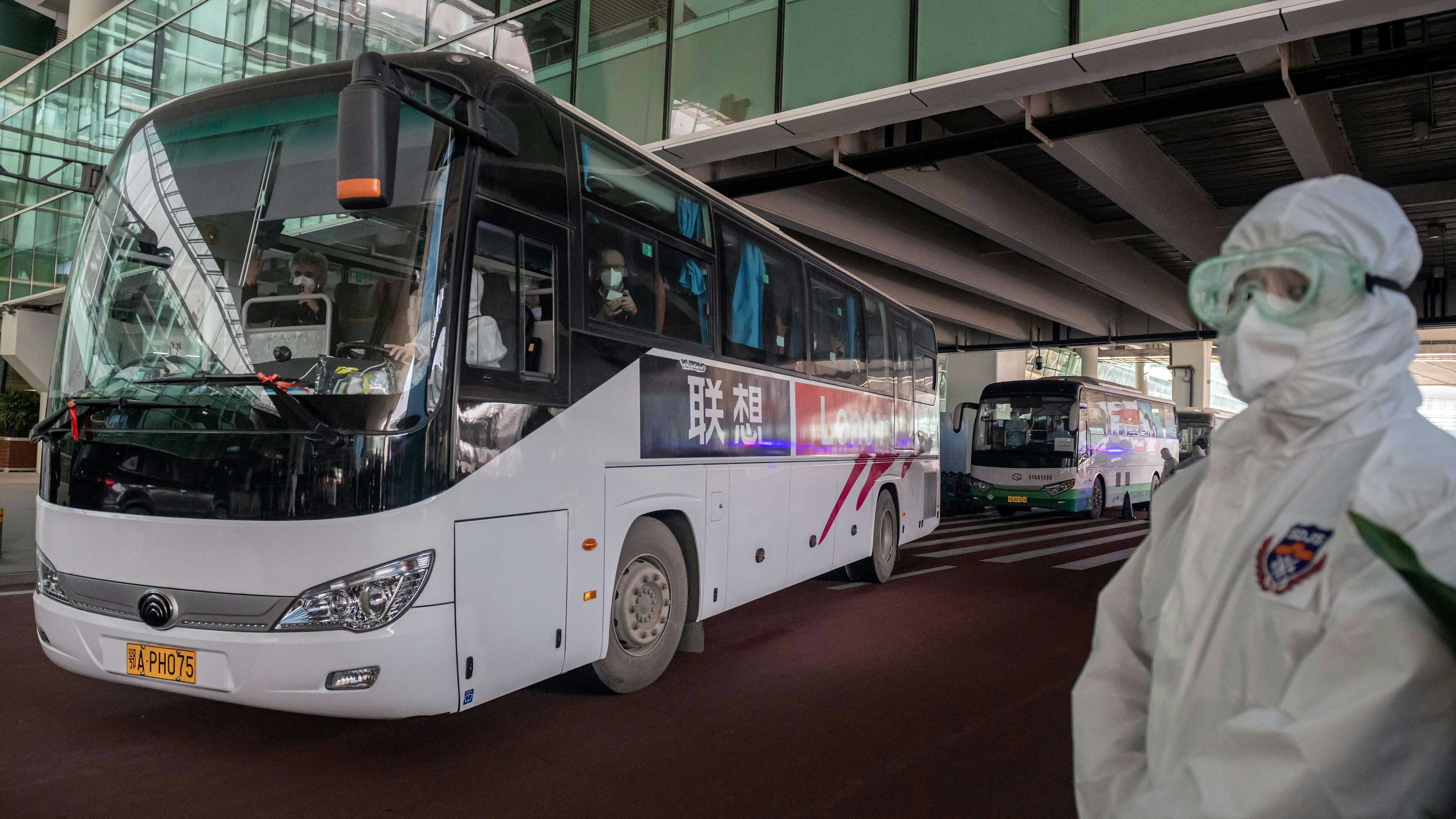 A bus carrying members of the World Health Organization (WHO) team investigating the origins of the Covid-19 pandemic leaves the airport following their arrival in Wuhan, China.
