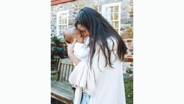 Krystina Wales, holding her second child during her leave in 2019.