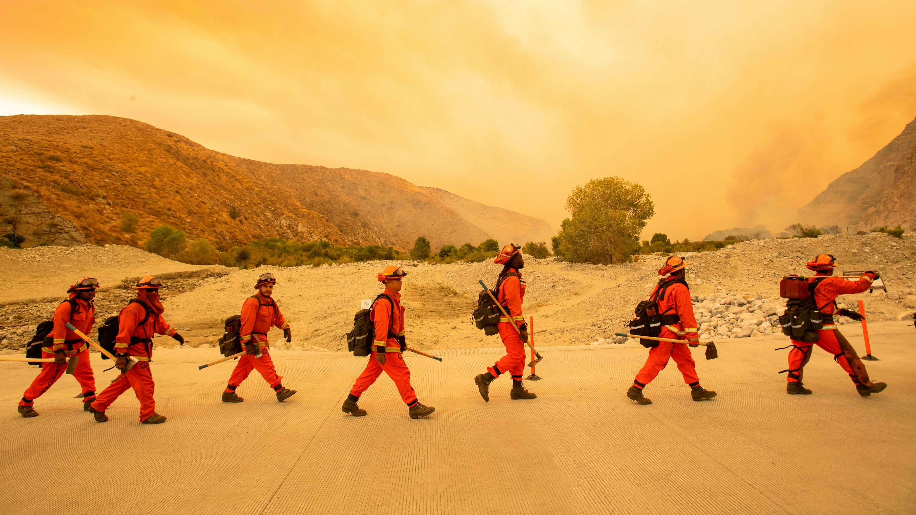 Inmate firefighters arrive at the scene of the Water fire, a new start about 20 miles from the Apple fire in Whitewater, California on August 2, 2020